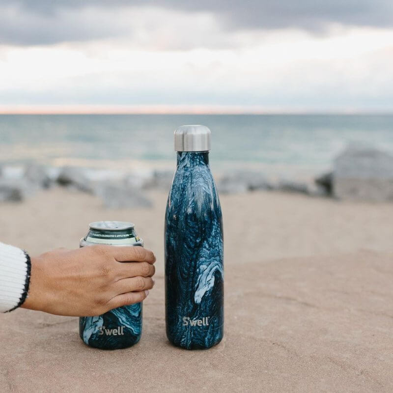 sustainable travel essentials - reusable bottles and travel mugs