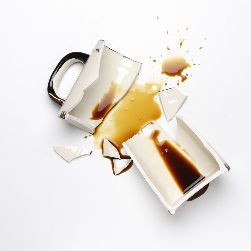 broken coffee mug and coffee spilling out, non-recyclable items