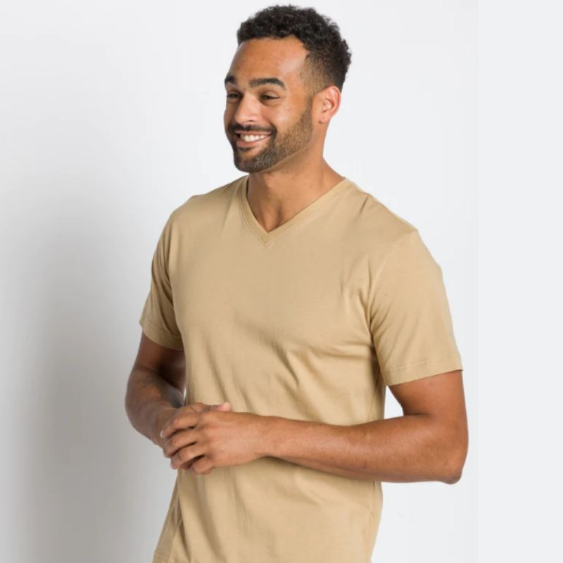 man wearing cream colored tshirt by Ably, sustainable men's clothing brands