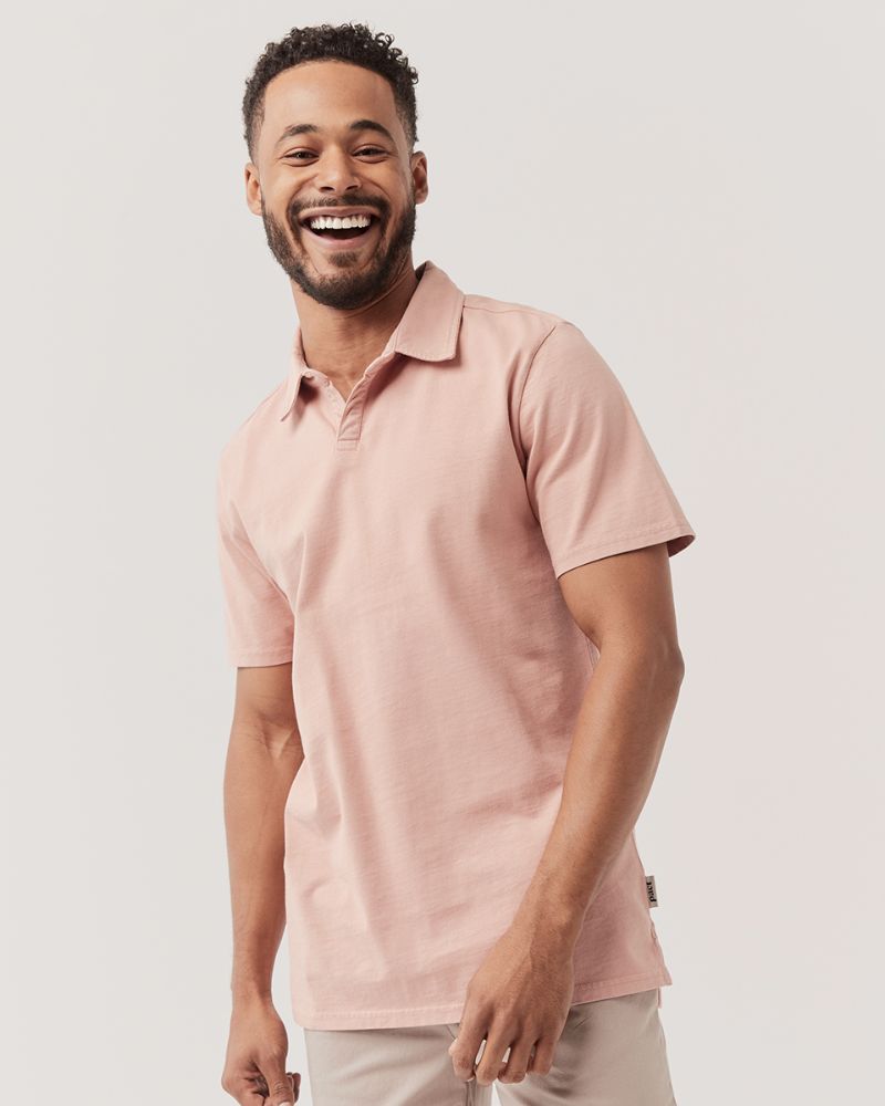 pink polo tshirt by PACT, one of the best sustainable men's clothing brands