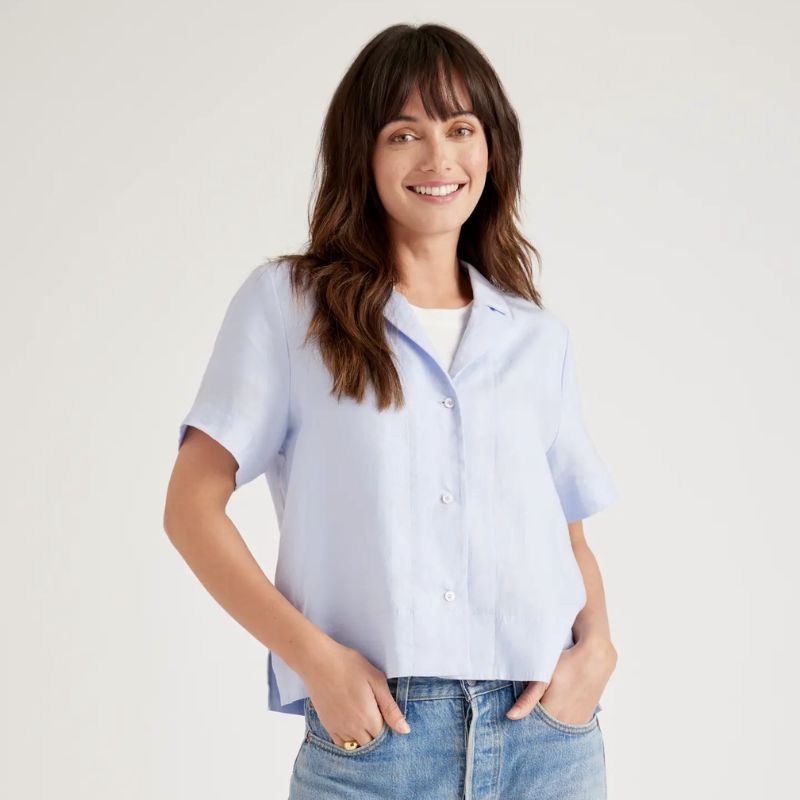 woman wearing blue short sleeved linen shirt