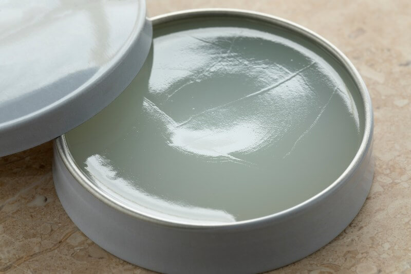 Little open tin and lid with vaseline