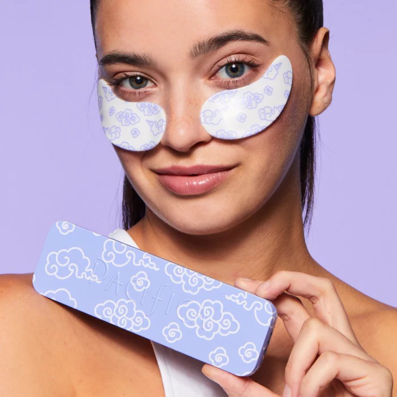 Woman wearing reusable under eye patches