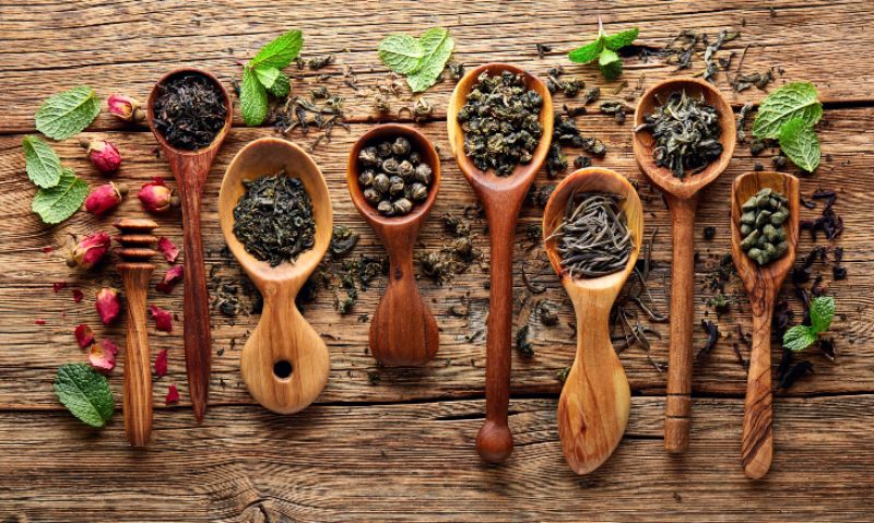 Tea leaves collection on wooden board
