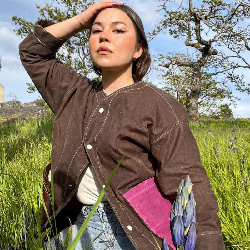woman wearing brown jacket made of waxed cotton, one of the animal leather alternatives