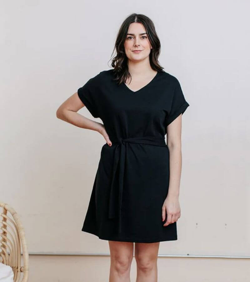 woman wearing cute black dress by ethical fashion brands