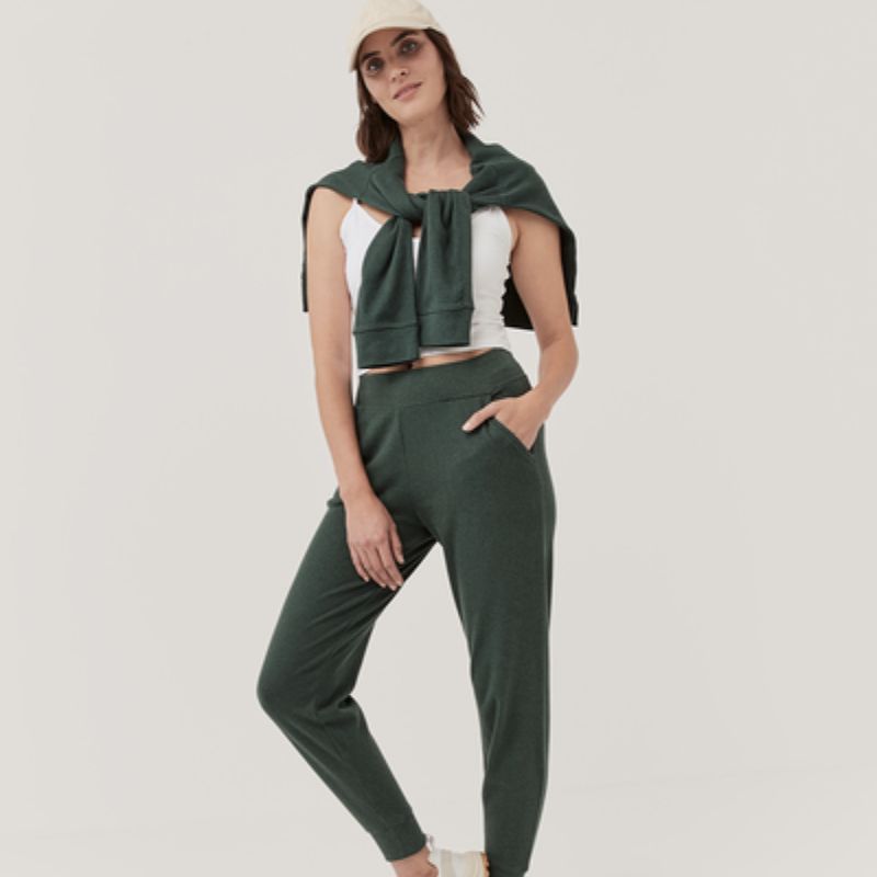 woman wearing green ethical joggers