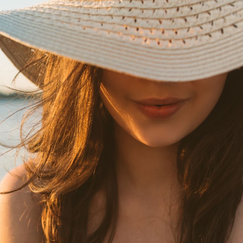 girl in a hat on the beach